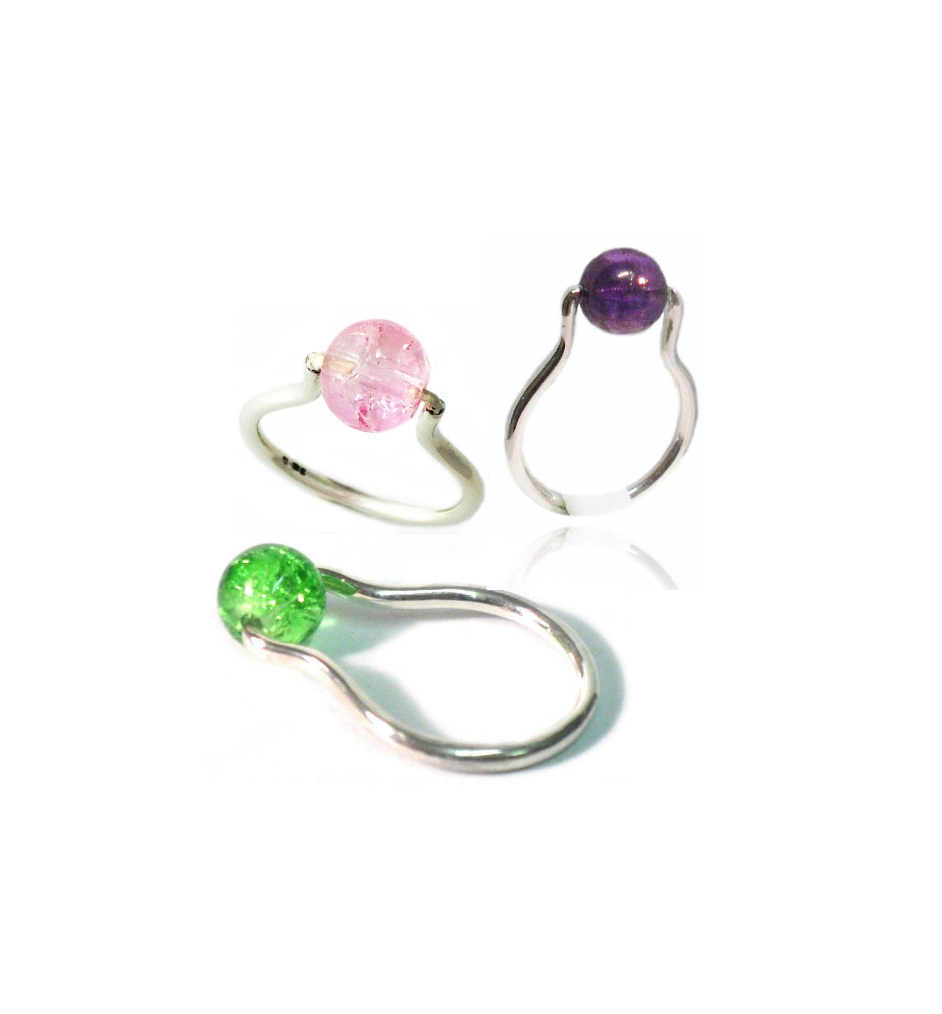 Sterling silver ring set with rotating acrylic high set bead. Green or purple
