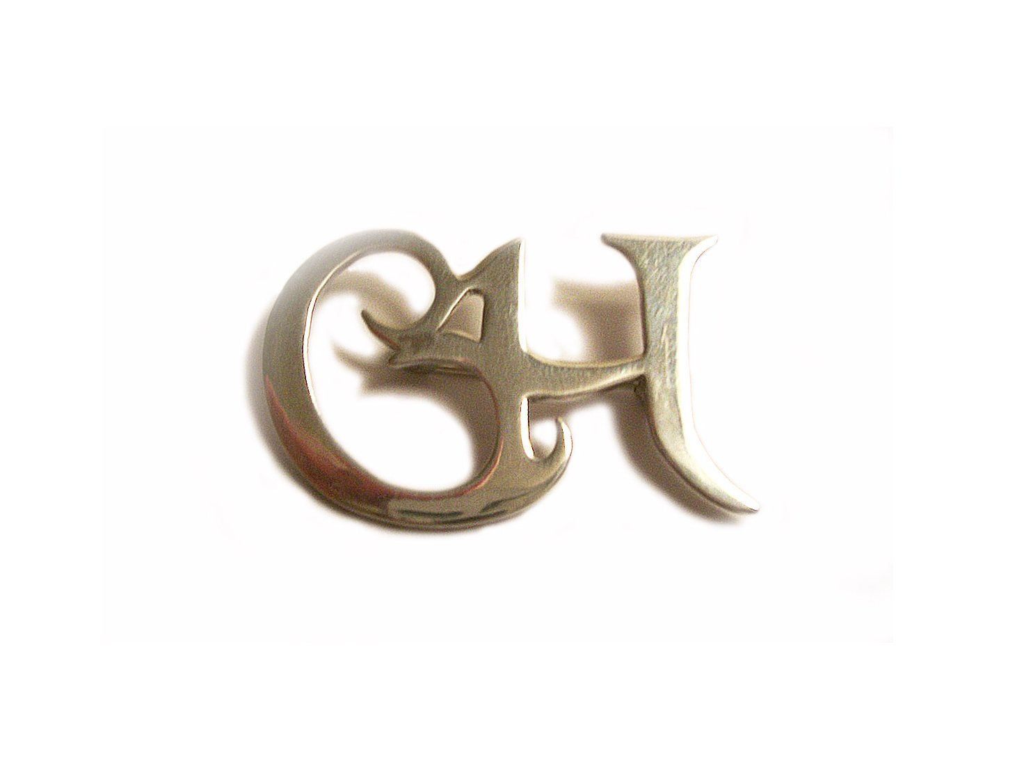 Sterling silver initial C H brooch.