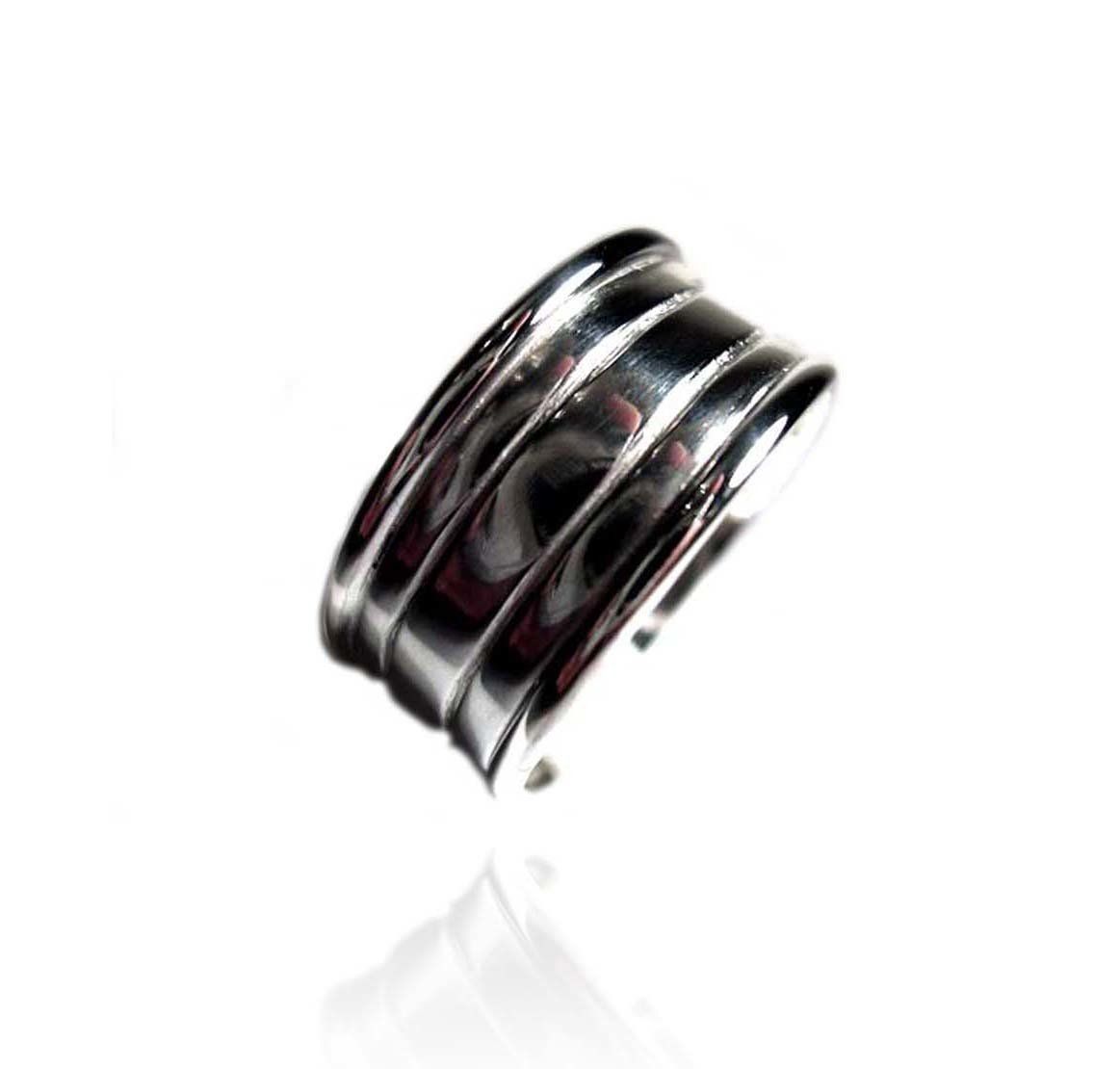 Sterling silver broad band with line engraving and raised edges.