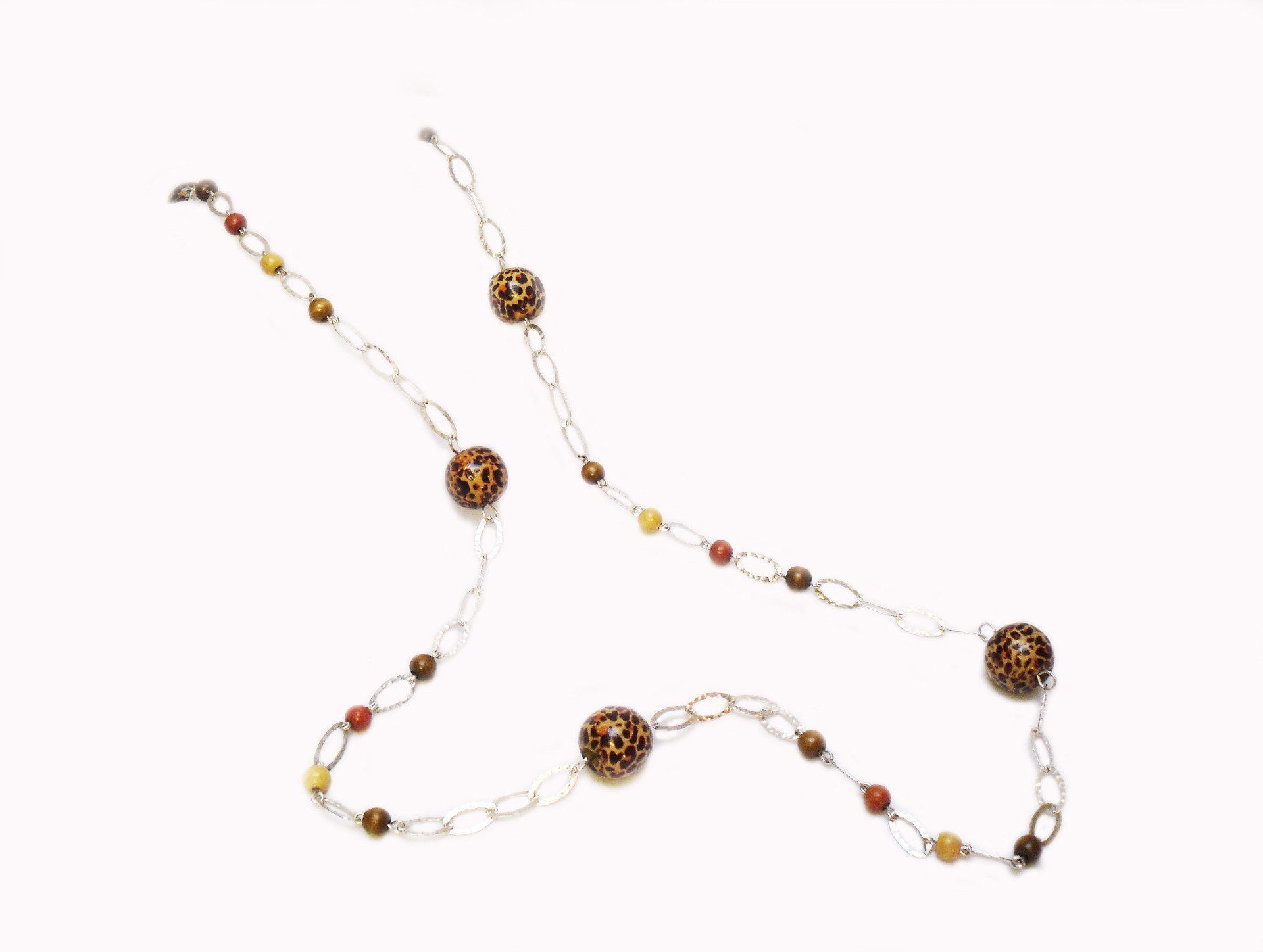 Long sterling silver textured necklace with large leopard print wooden beads.