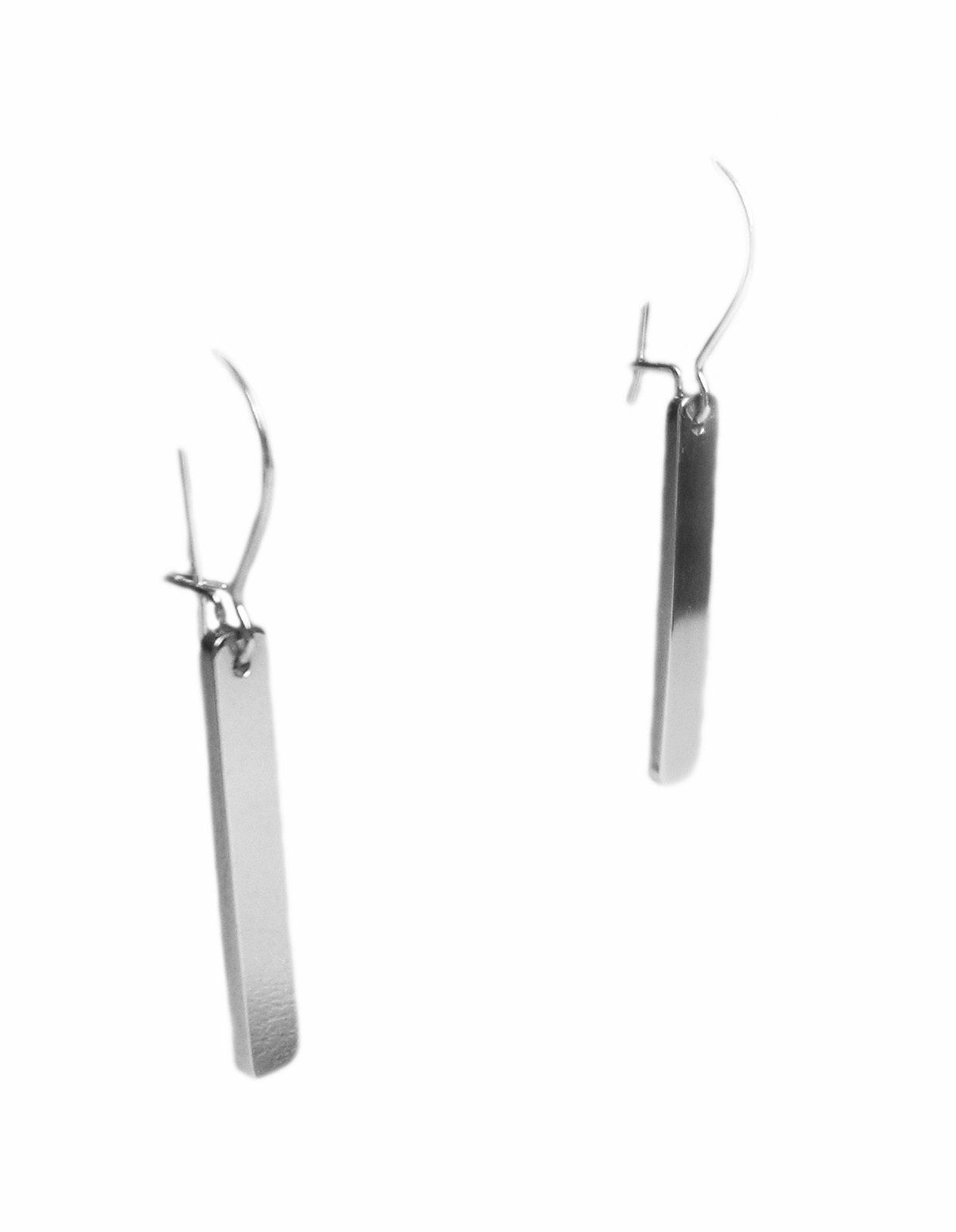 Plain drop earrings hand pierced from sterling silver sheet with kidney wire earring fittings.