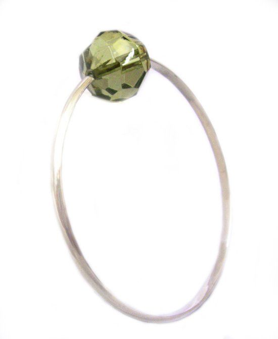 Sterling silver fine bangle with a large moss green faceted acrylic bead.