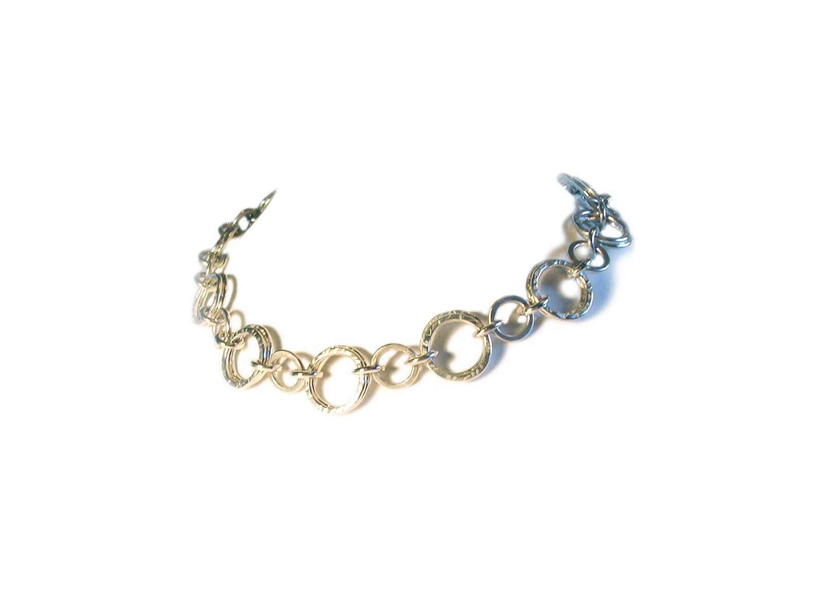 Heavy sterling silver circle style necklace with hammered flat circles & rings.