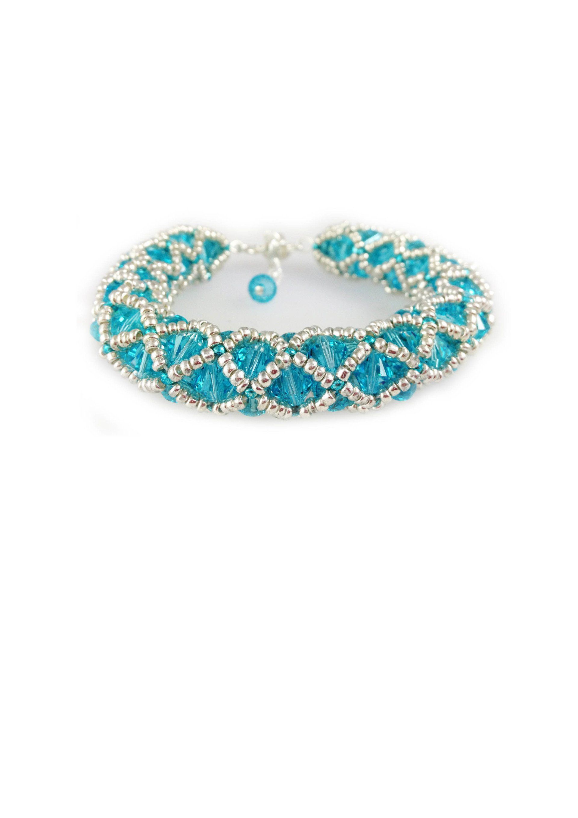 Woven beaded bracelet made with swarovski bicone beads, seed beads,silver plated lobster catch & extension chain. Length: 7.5