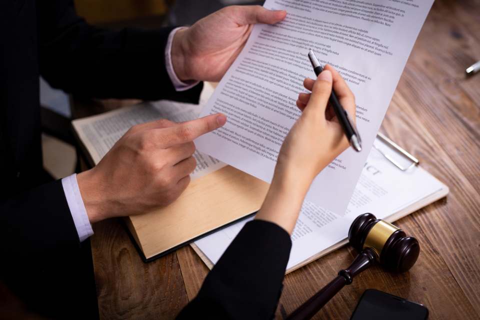 A few men going over contracts