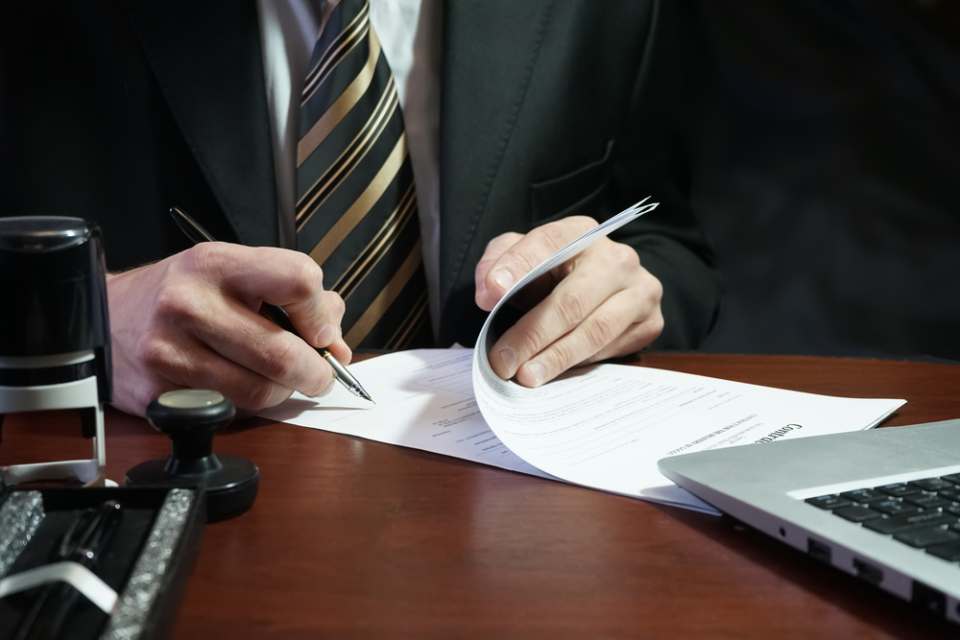 A man perusing a contract