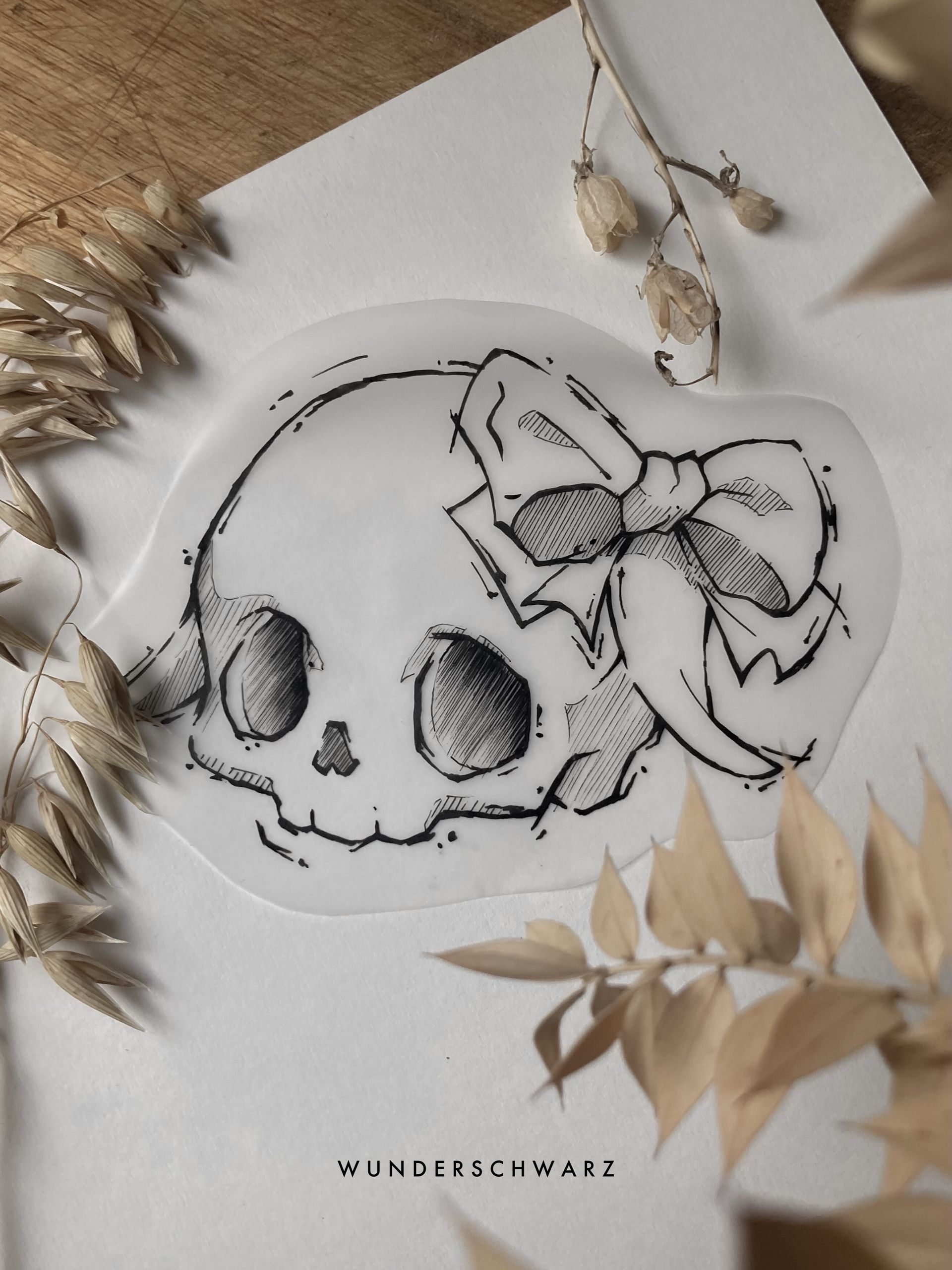 sketchy Zeichnung von einem süßen Schädel mit Schleife