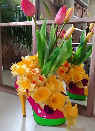 Artificial Flower Arrangement with a daffodils and tulips in a full size brightly coloured shoe