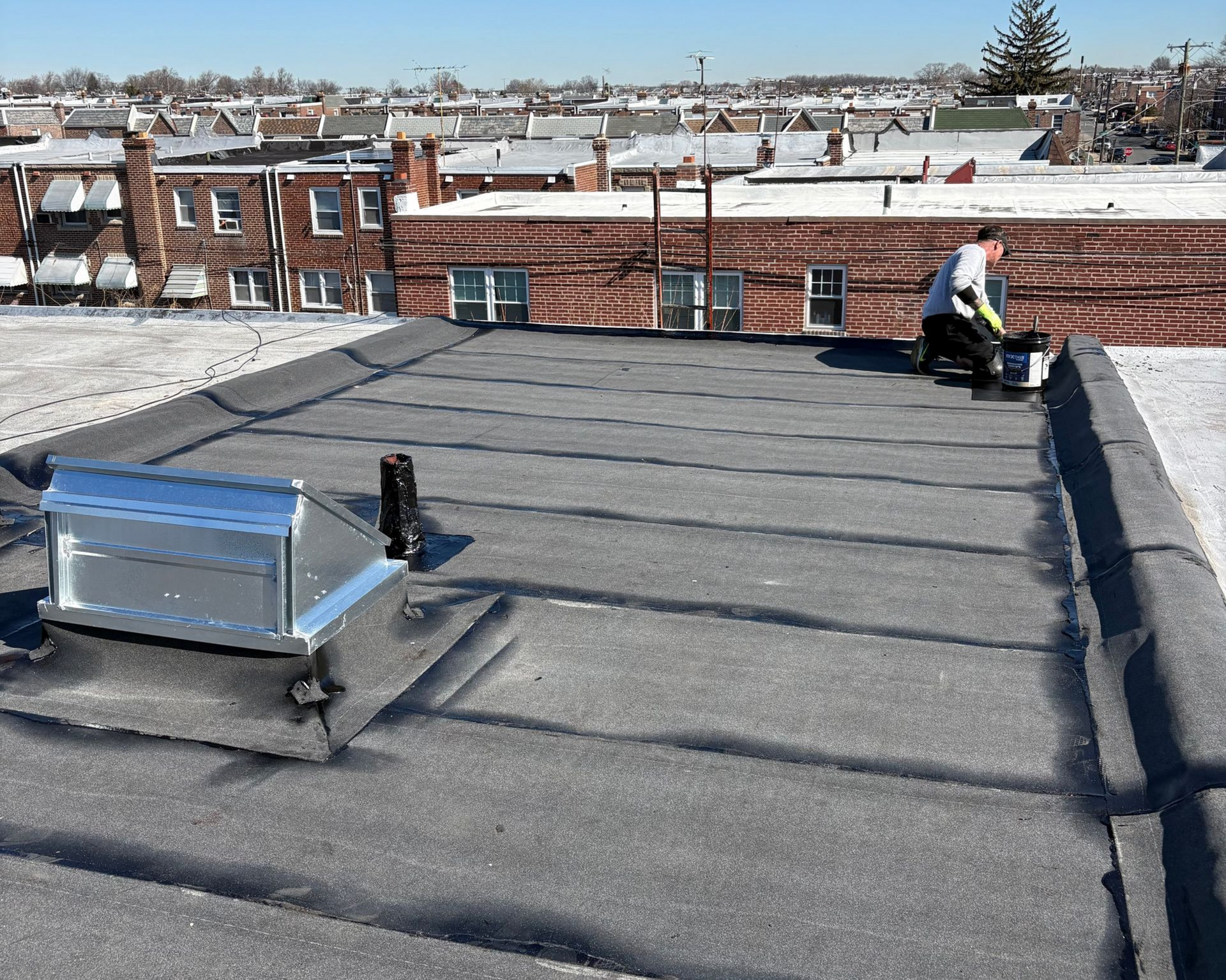 new torchdown rubber roof with new skylight in Philadelphia