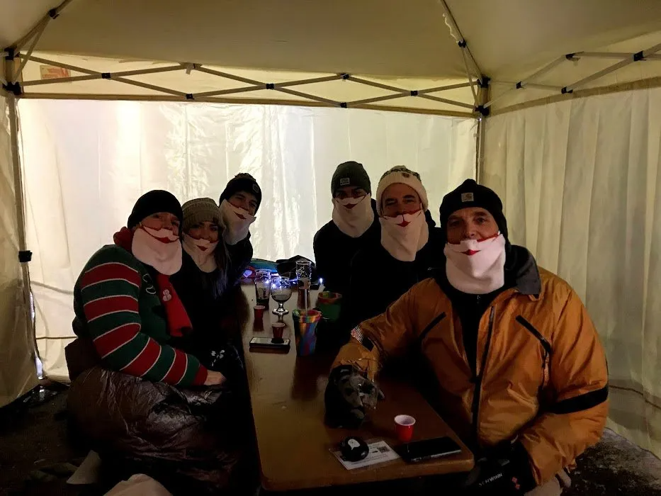 Showing off our Christmas Masks.  We slid them down to put the mustache below the nose for the picture, otherwise we wear them over our noses.