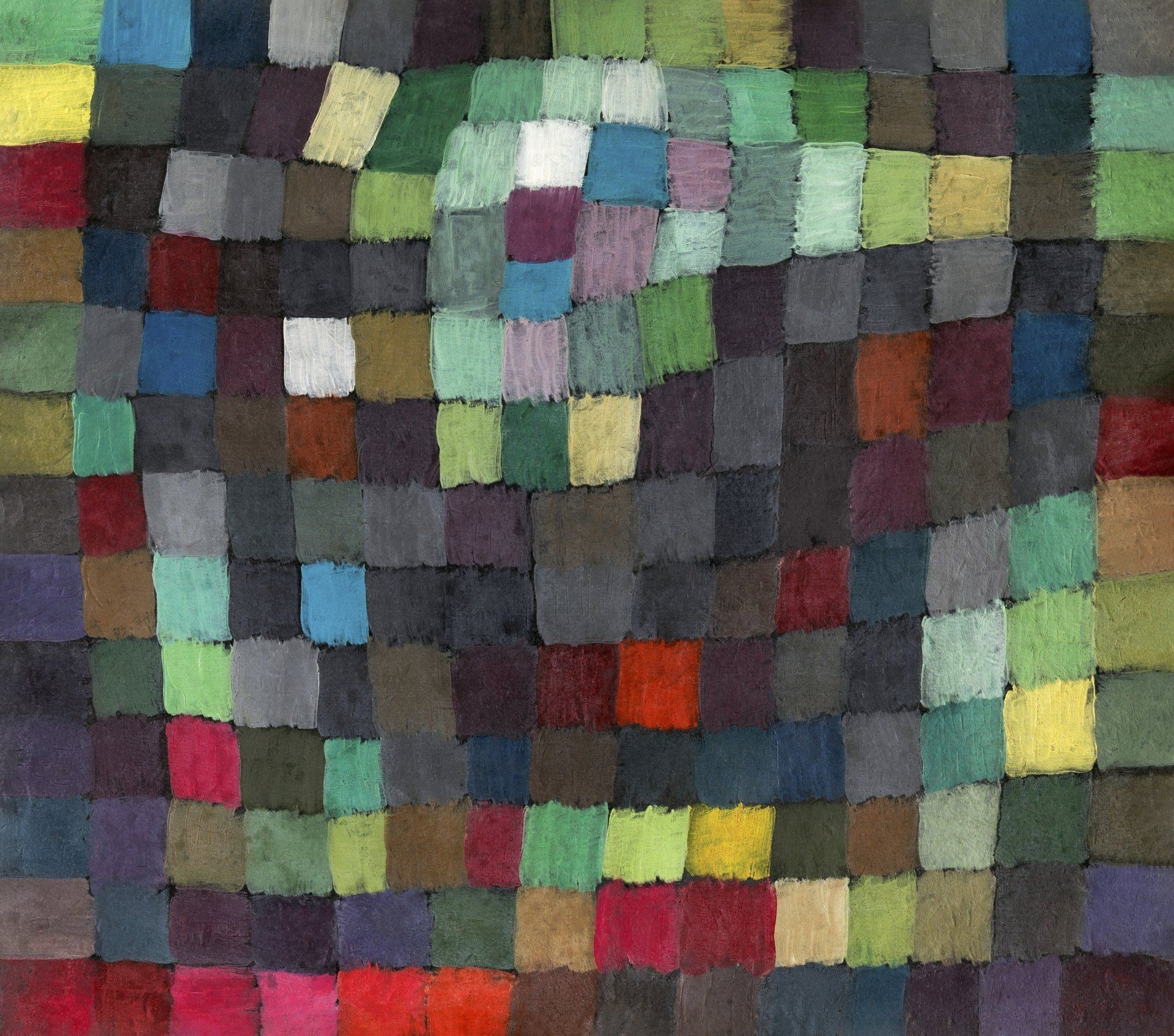 a patchwork of painted squares in various greens, blues, and reds
