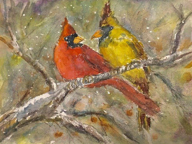 watercolor painting of a male and female cardinal sitting together on a branch with snowflakes