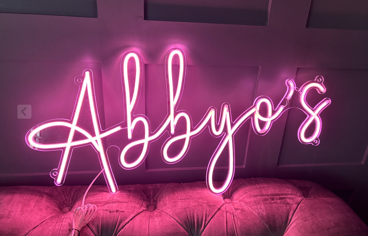 A custom led neon sign in light pink
