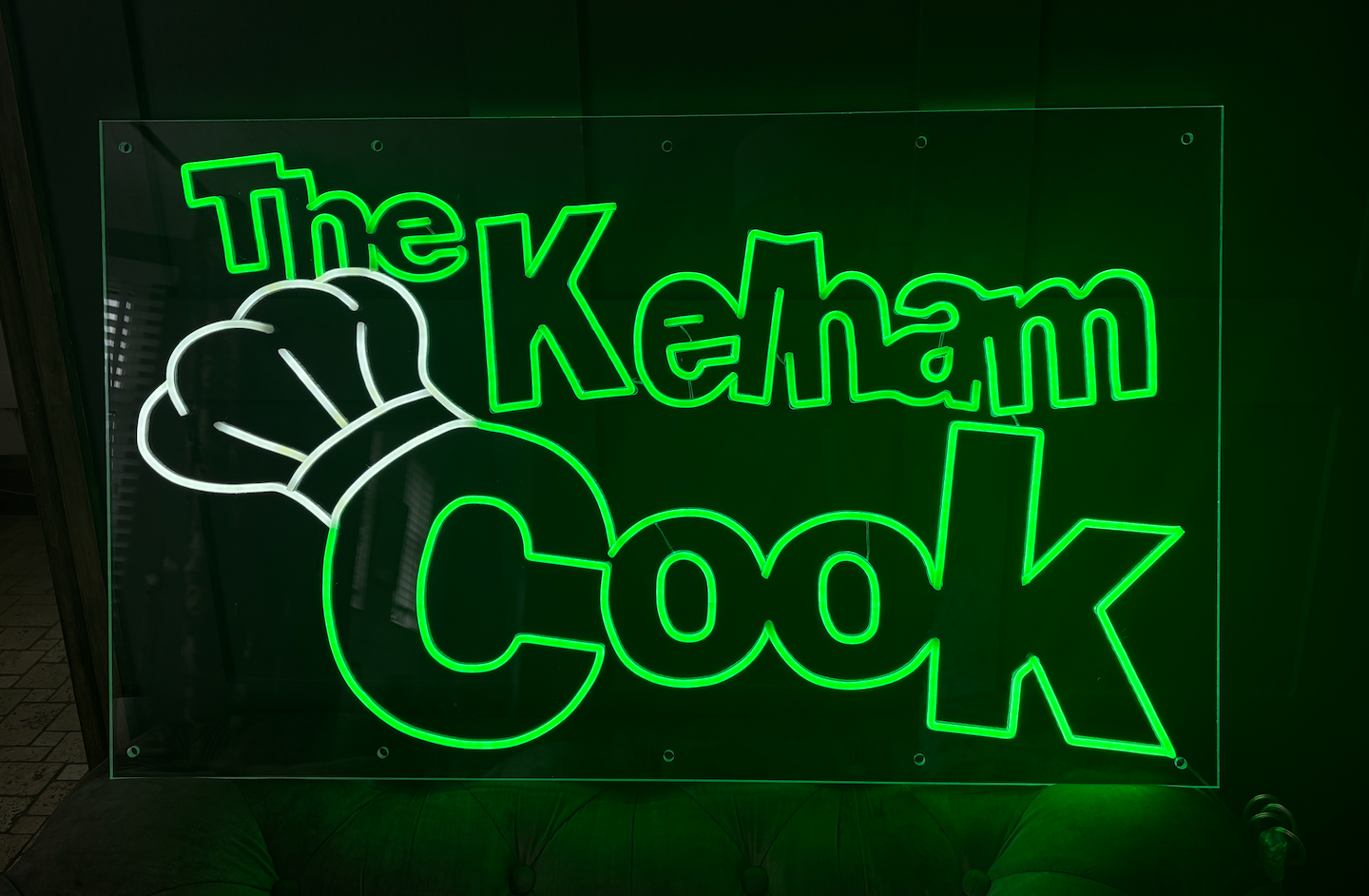 a customers logo as an LED Neon sign using green and white