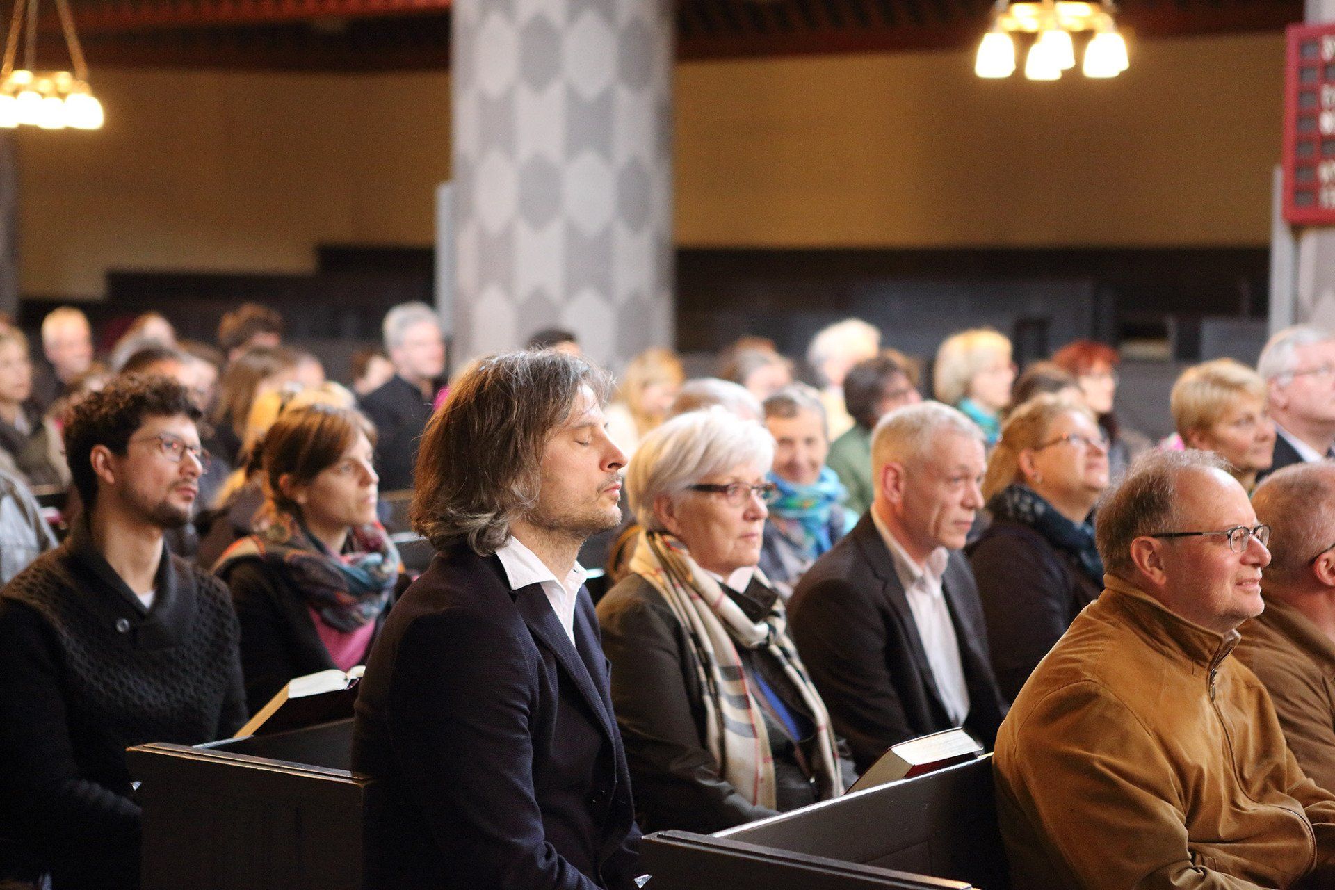Sebastian Bieniek went from the back to front row, during the mass that took place in the University Church of Marburg in 2016 and asked everyone Sebastian Bieniek went from the back to front row, during the mass that took place in the University Church of Marburg in 2016 and asked everyone