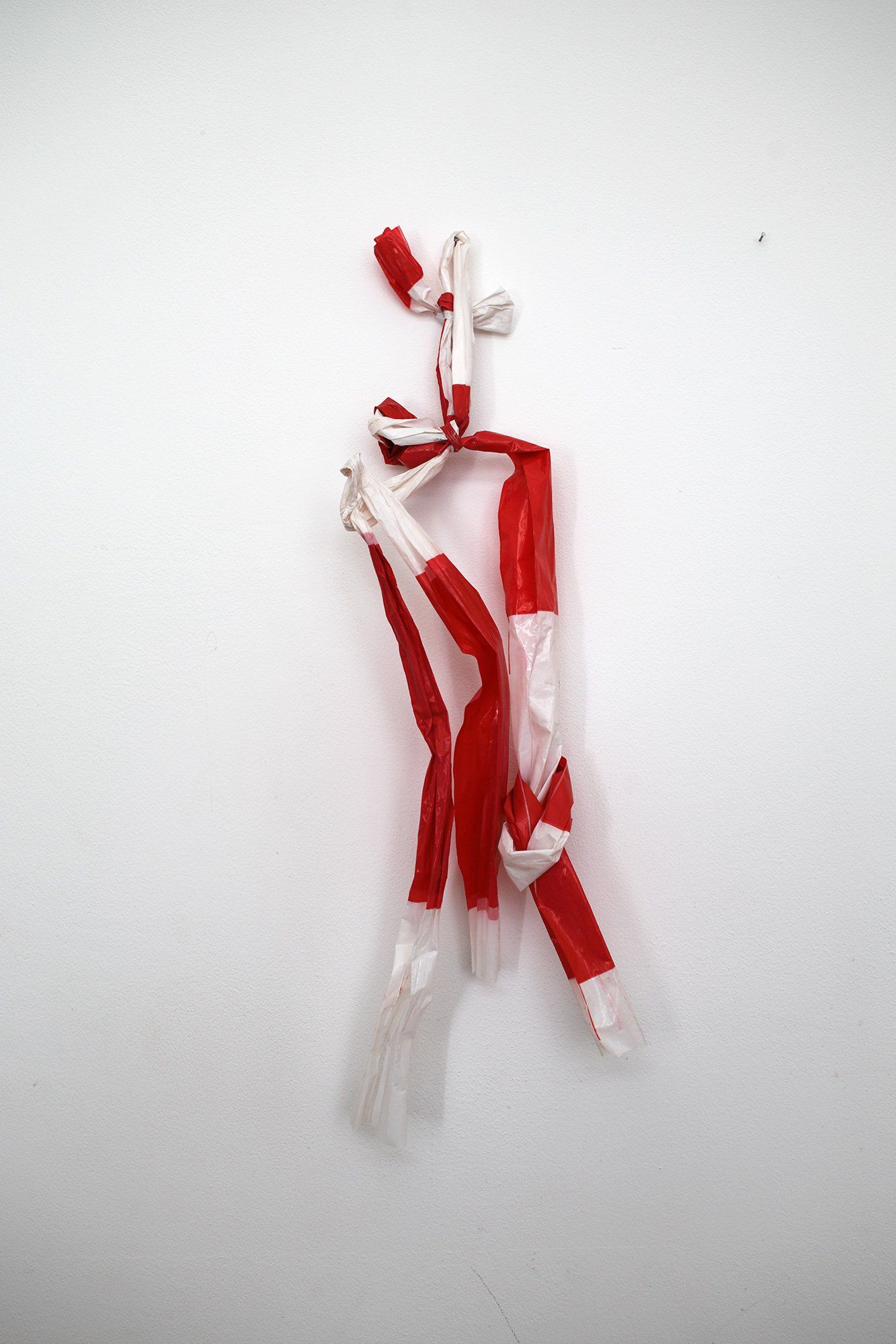 „Symbol of Victory over the Virus“ (also „2020 No. 1“) by Sebastian Bieniek (B1EN1EK), the inventor of „Barrier Tape Art“, created in april 2020. 35 x 18 cm. x 3cm. Barrier Tape Art installed on wall. „Symbol of Victory over the Virus“ (also „2020 No. 1“) by Sebastian Bieniek (B1EN1EK), the inventor of „Barrier Tape Art“, created in april 2020. 35 x 18 cm. x 3cm. Barrier Tape Art installed on wall.