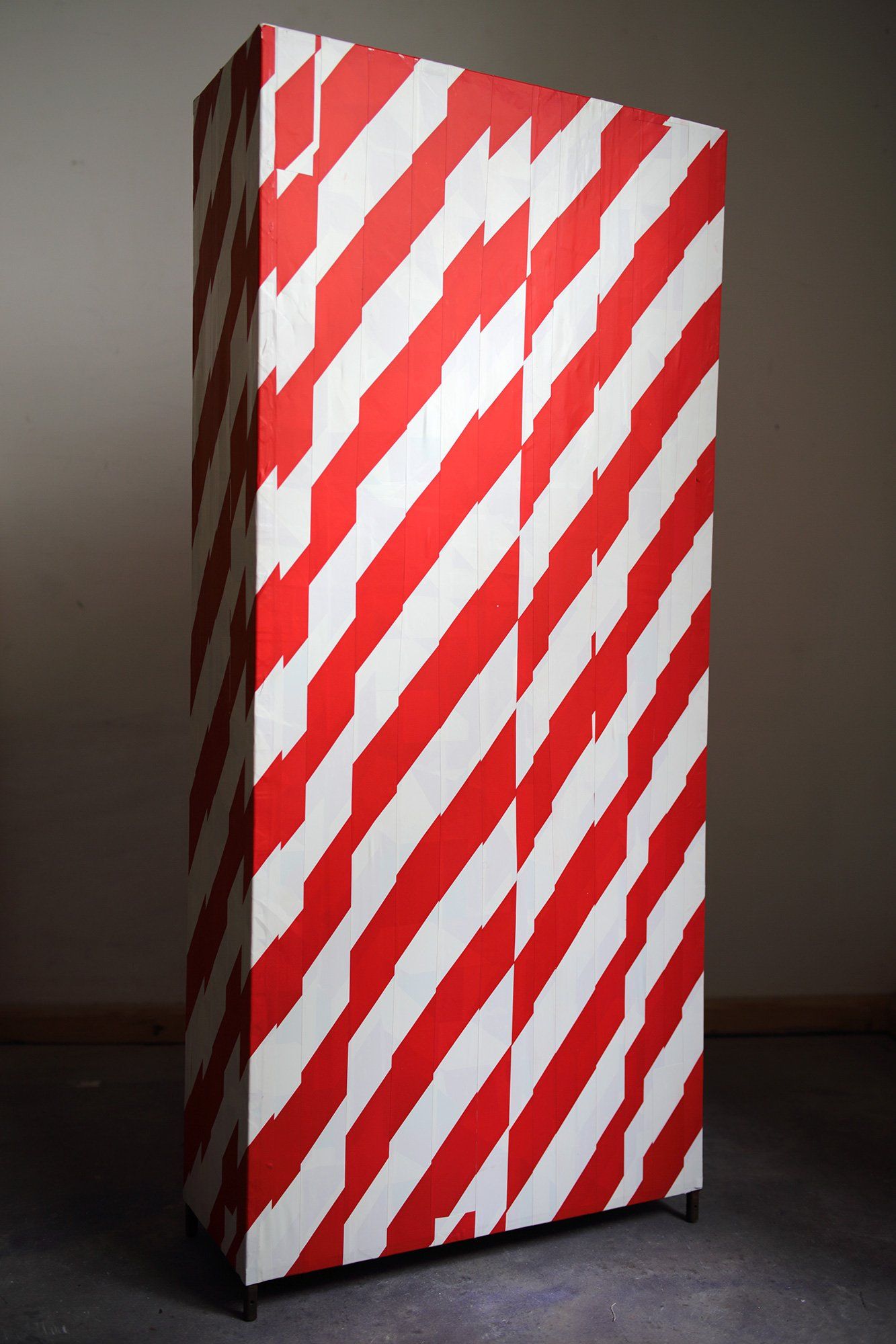 „Barrier Tape Tower No. 2“ by Sebastian Bieniek (B1EN1EK), the inventor of „Barrier Tape Art“. Created in may 2020. Size: 114 cm. x 50 cm. x 20 cm.
