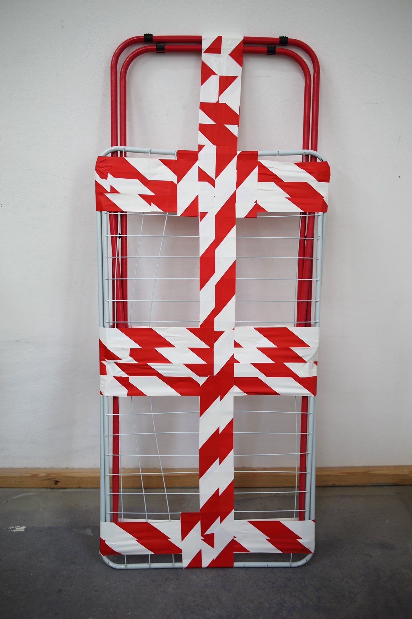 „Barrier Tape on Clothes Horse“ (also „Barrier Tape Object No. 6“) by Sebastian Bieniek (B1EN1EK), the inventor of „Barrier Tape Art“. Created in april 2020. 131 x 49 x 4 cm. „Barrier Tape on Clothes Horse“ (also „Barrier Tape Object No. 6“) by Sebastian Bieniek (B1EN1EK), the inventor of „Barrier Tape Art“. Created in april 2020. 131 x 49 x 4 cm.