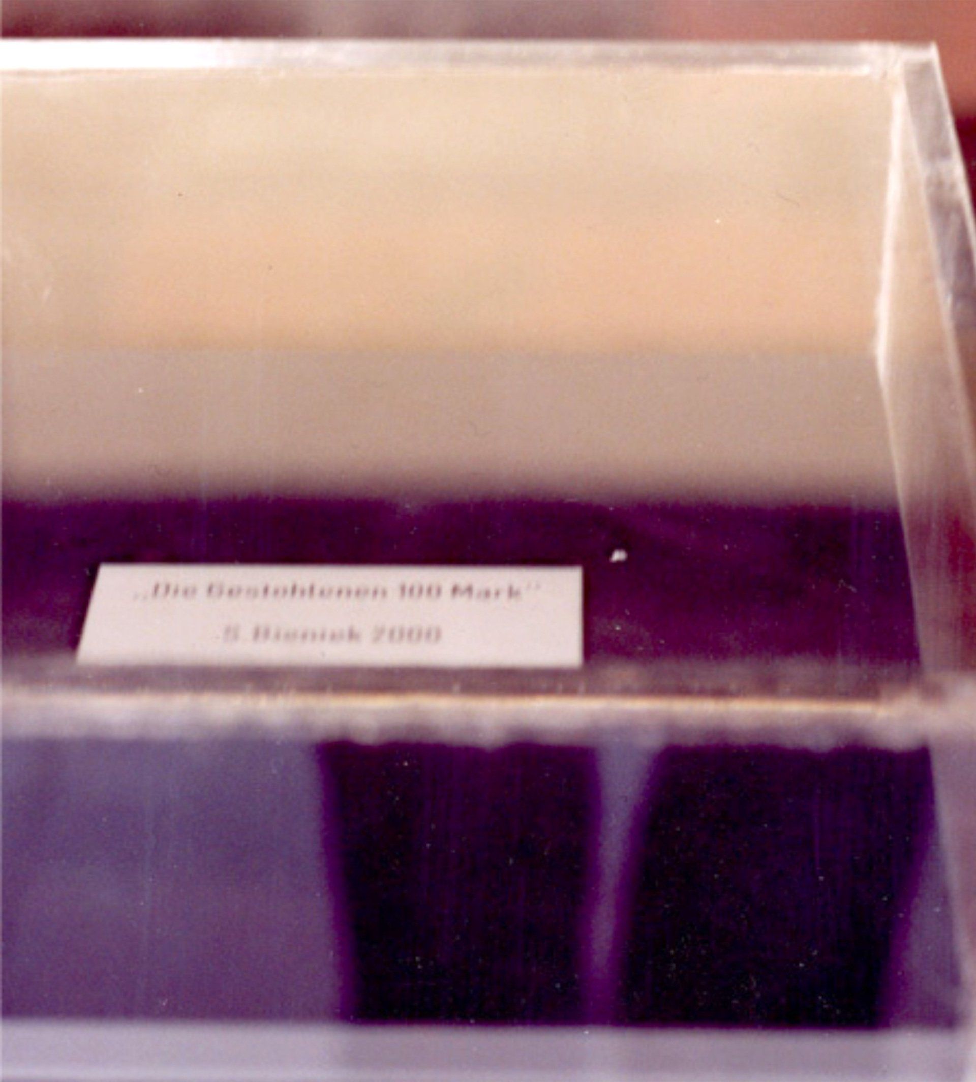 And then suddenly the 100 DM note was stolen by someone. At the same time, however, a sign was visible   underneath that read  And then suddenly the 100 DM note was stolen by someone. At the same time, however, a sign was visible   underneath that read