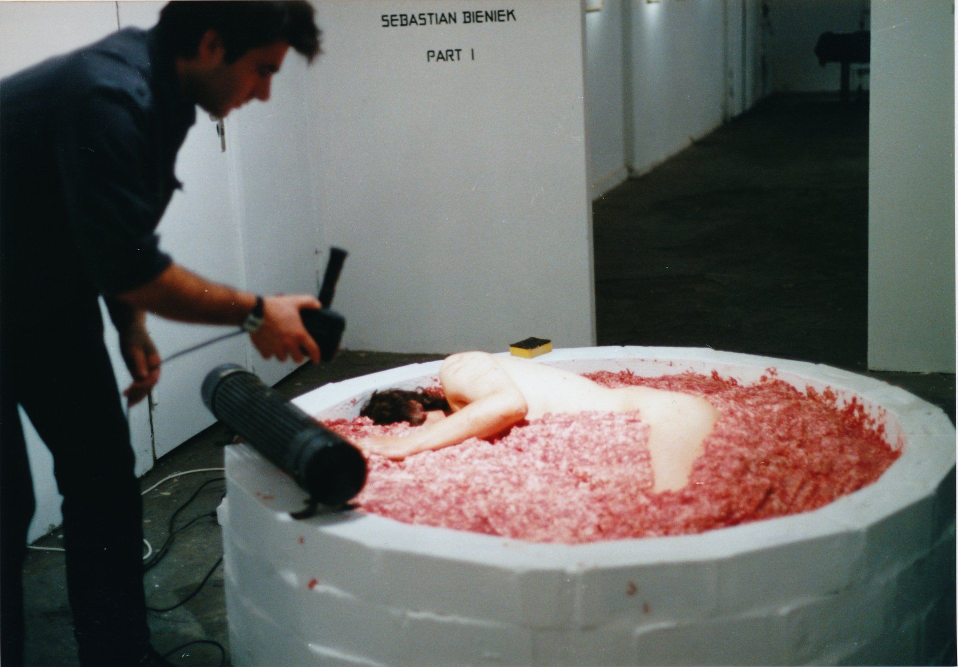 Sebastian Bieniek Performance, 1999, lying in half a ton of minced meat for three days. Kunthaus Tacheles, Berlin. Sebastian Bieniek Performance, 1999, lying in half a ton of minced meat for three days. Kunthaus Tacheles, Berlin.