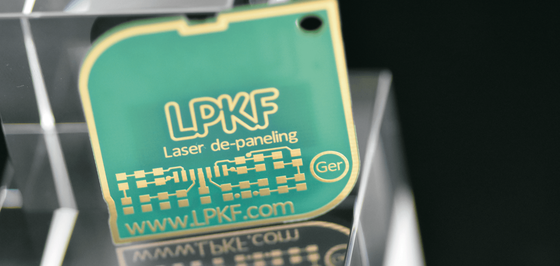 Photo of FR 4 circuit board separated by laser cutting and marked with laser.