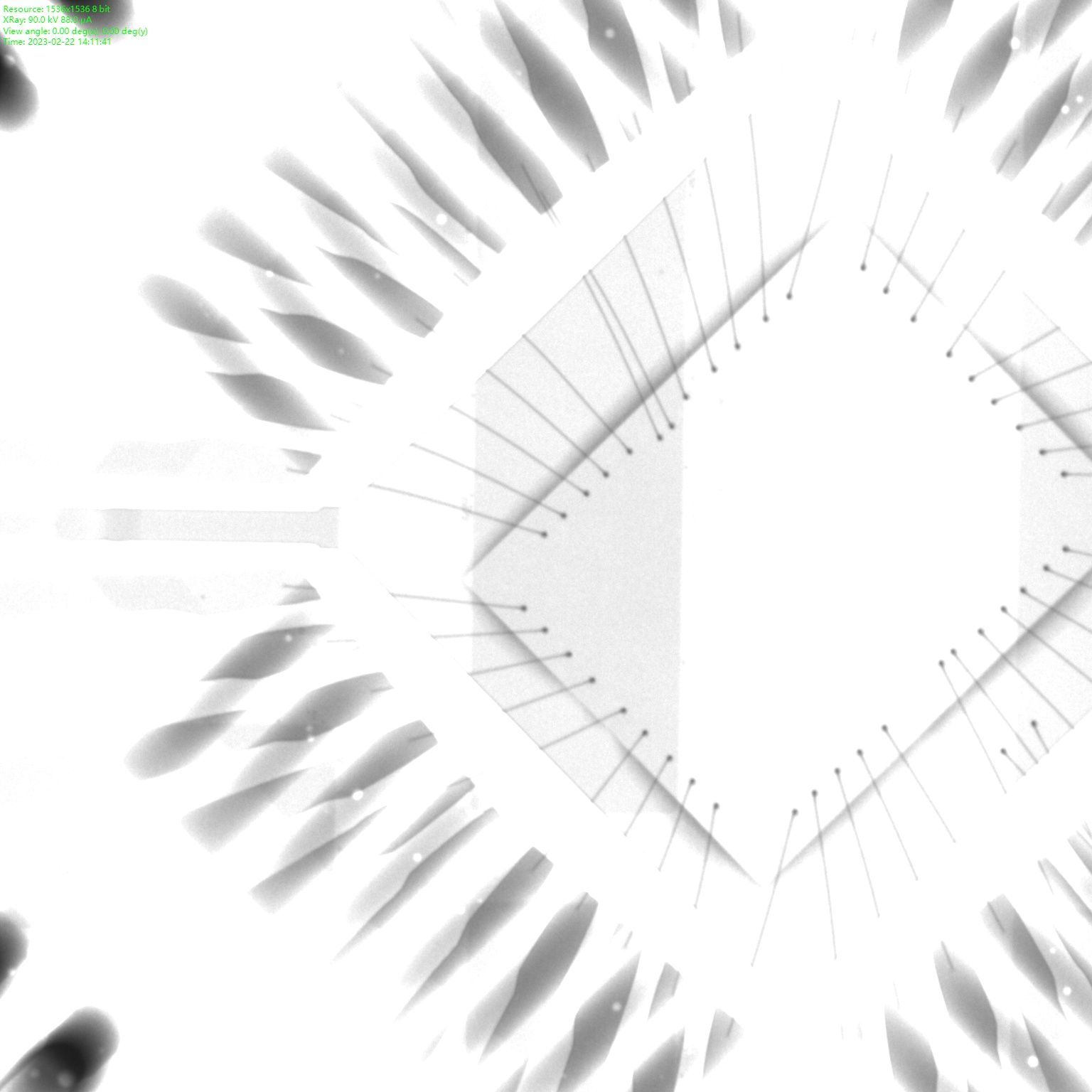 X-ray image of IC with to much power applied: image is very light, wires not completely visible