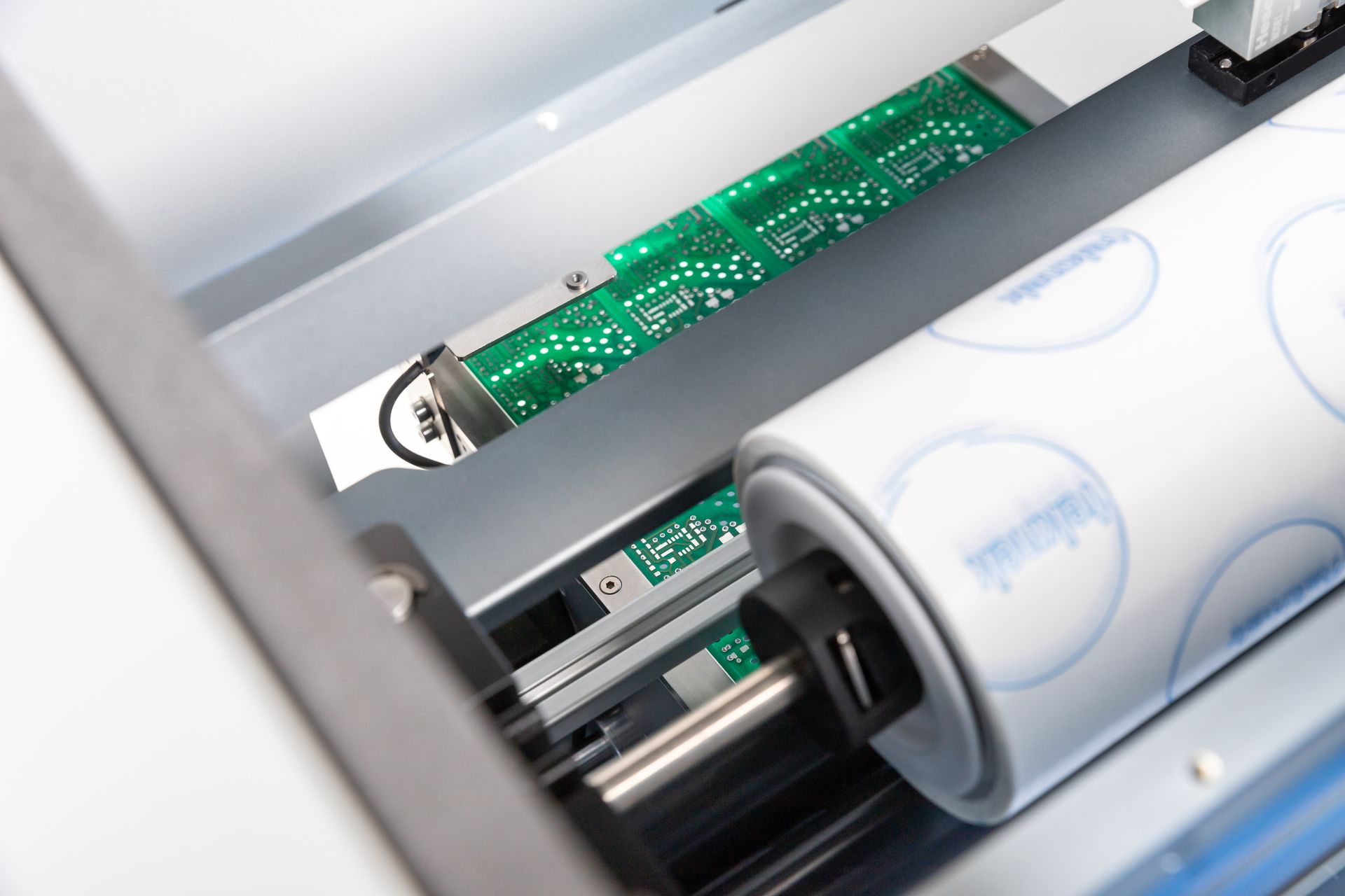 Close-up image of inline PCB contact cleaning