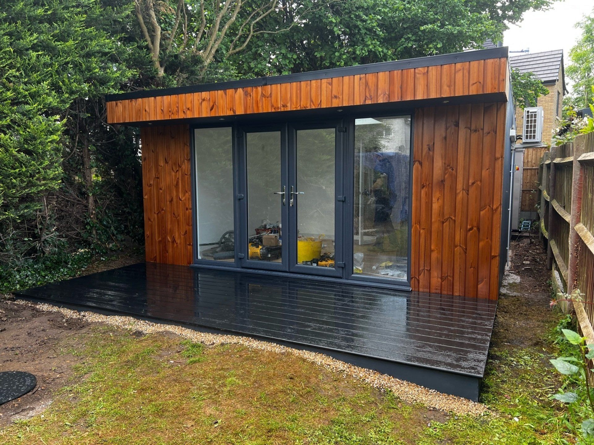Red cedar garden room constructed with SIP panels, showcasing a modern and sustainable design