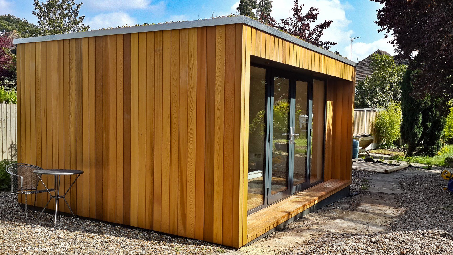 Red cedar garden room constructed with SIP panels, showcasing a modern and sustainable design