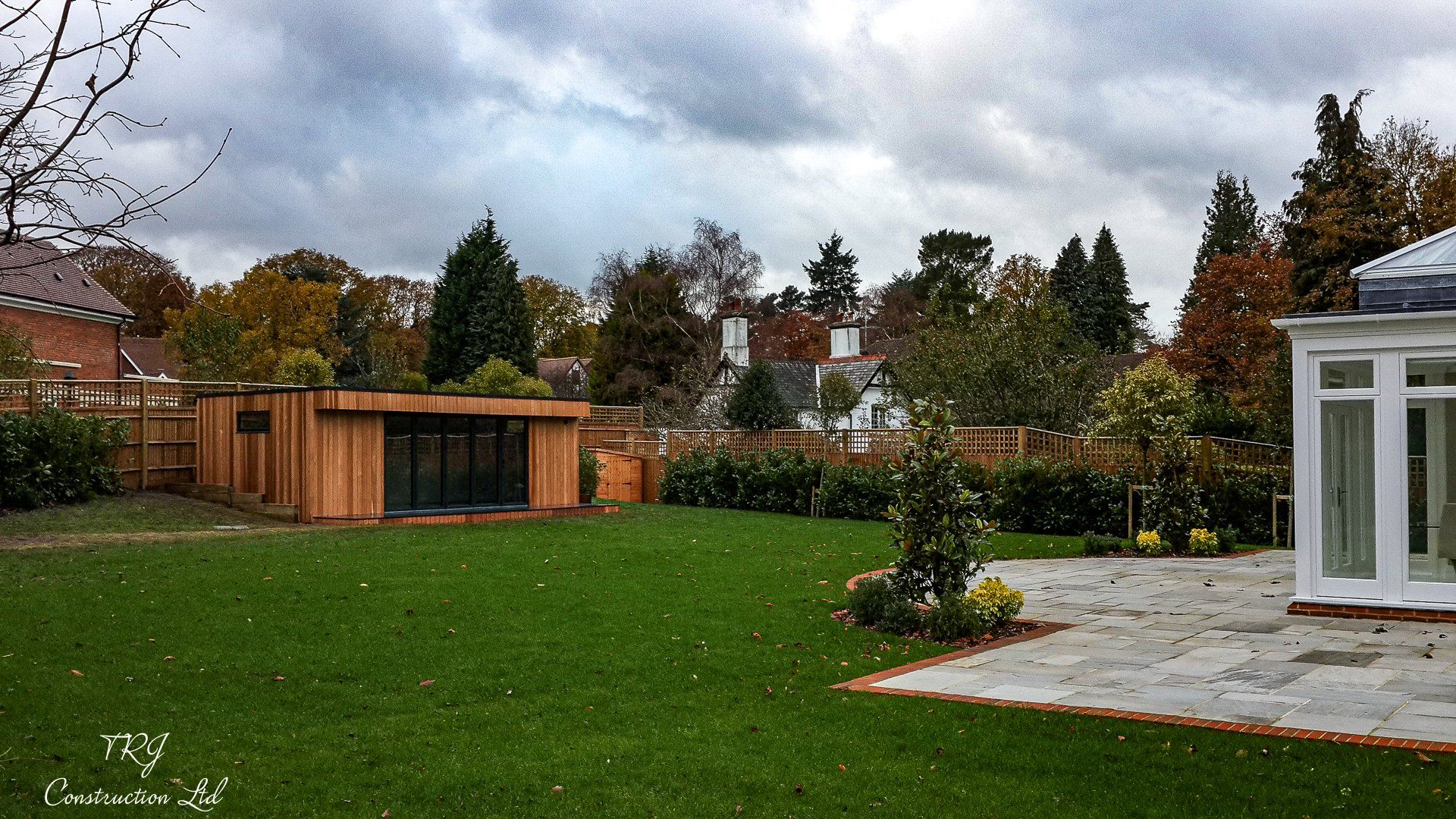 Red cedar garden room constructed with SIP panels, showcasing a modern and sustainable design