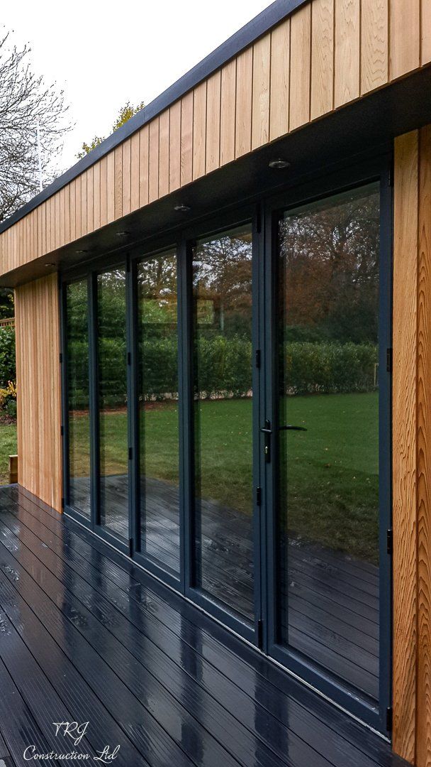 Red cedar garden room constructed with SIP panels, showcasing a modern and sustainable design