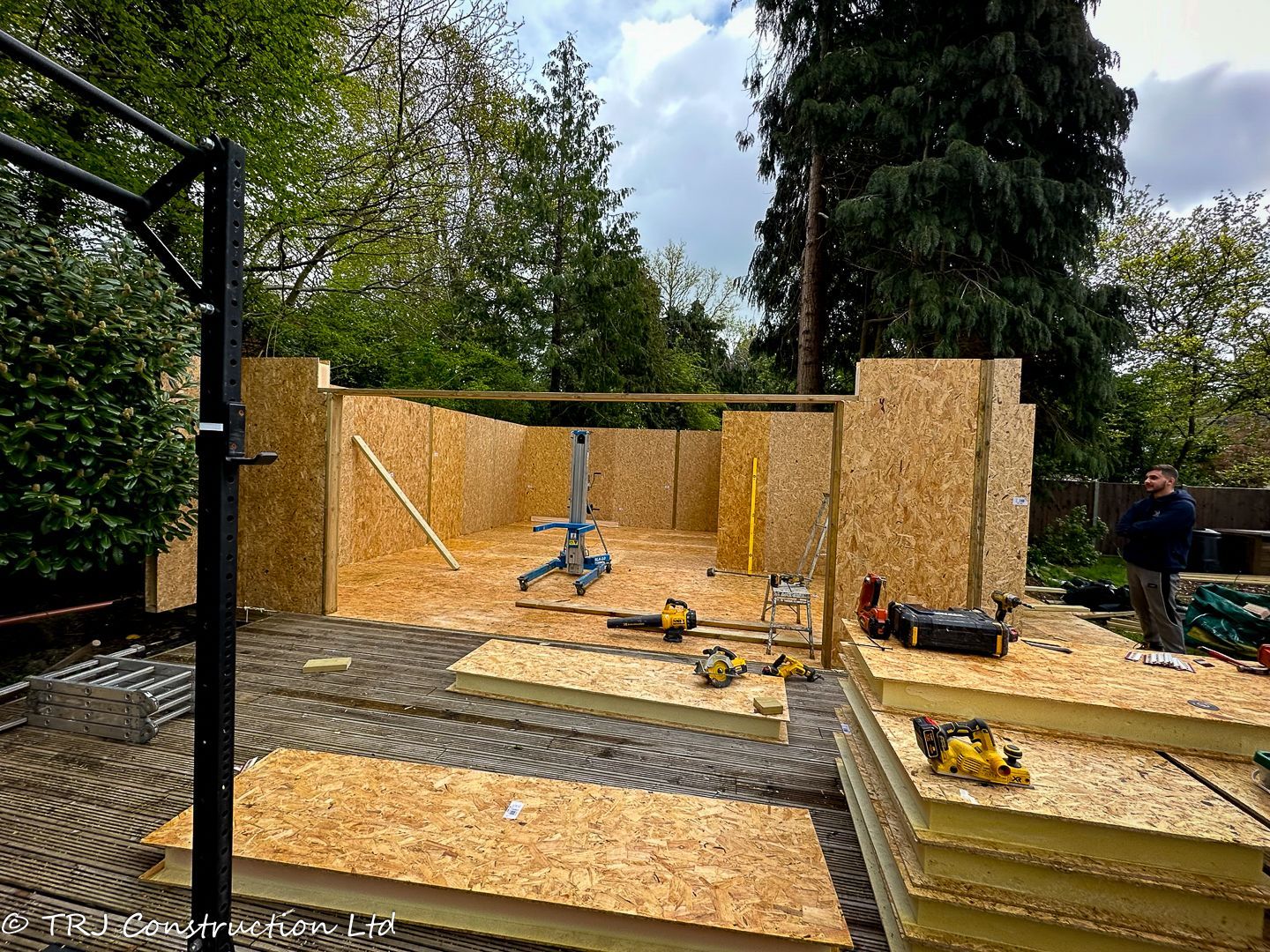 Structural Insulated Panels (SIPs) stacked for a construction project.