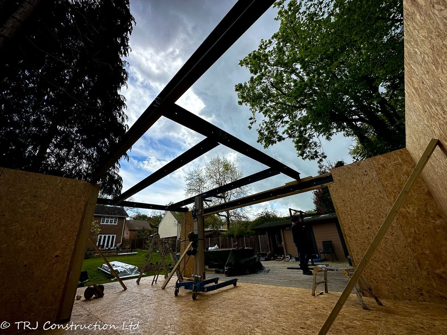 Builders assembling SIP panels for a rapid home construction.