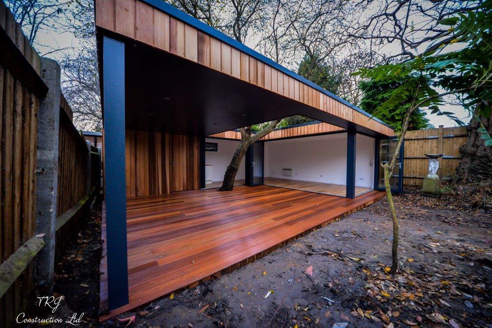 Red cedar garden room constructed with SIP panels, showcasing a modern and sustainable design
