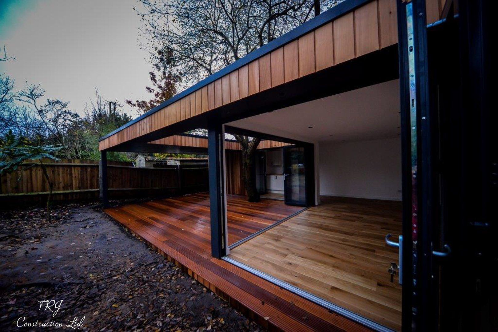 Red cedar garden room constructed with SIP panels, showcasing a modern and sustainable design