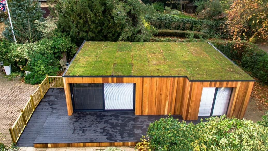 Red cedar garden room constructed with SIP panels, showcasing a modern and sustainable design
