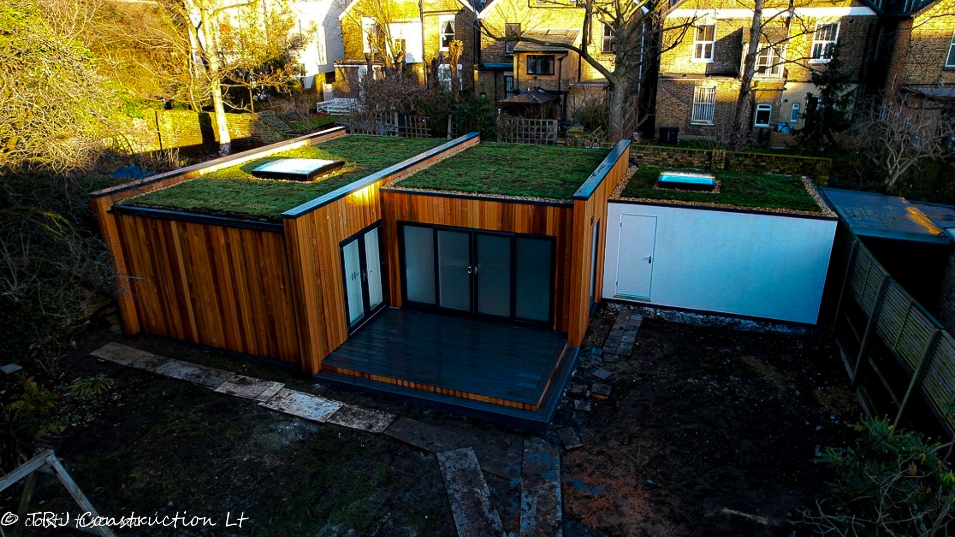 Red cedar garden room constructed with SIP panels, showcasing a modern and sustainable design
