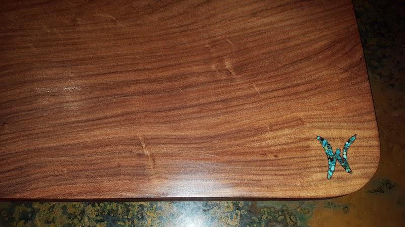 wooden cutting board with turquoise inlay