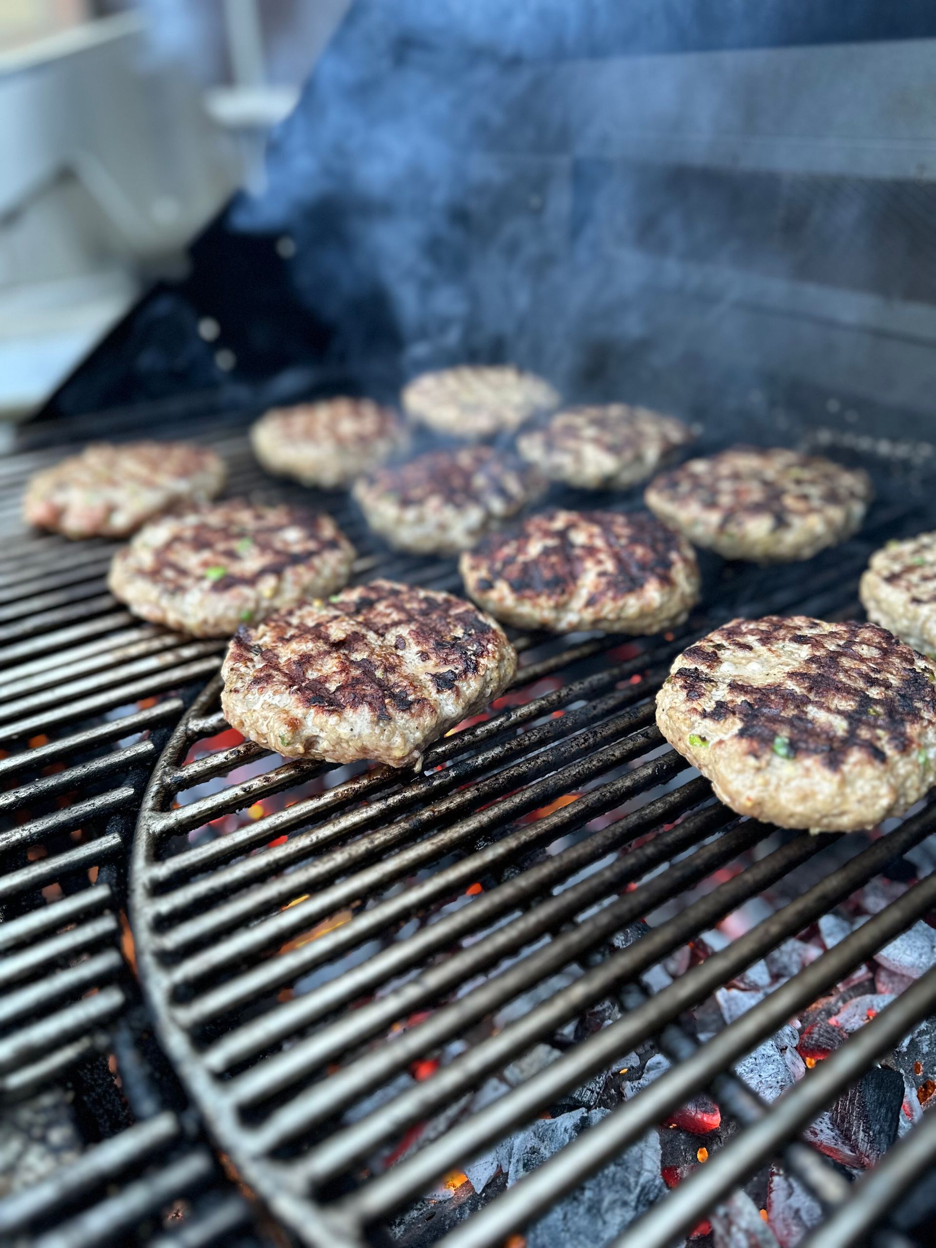 Pork dumpling filling patties on the gas grill