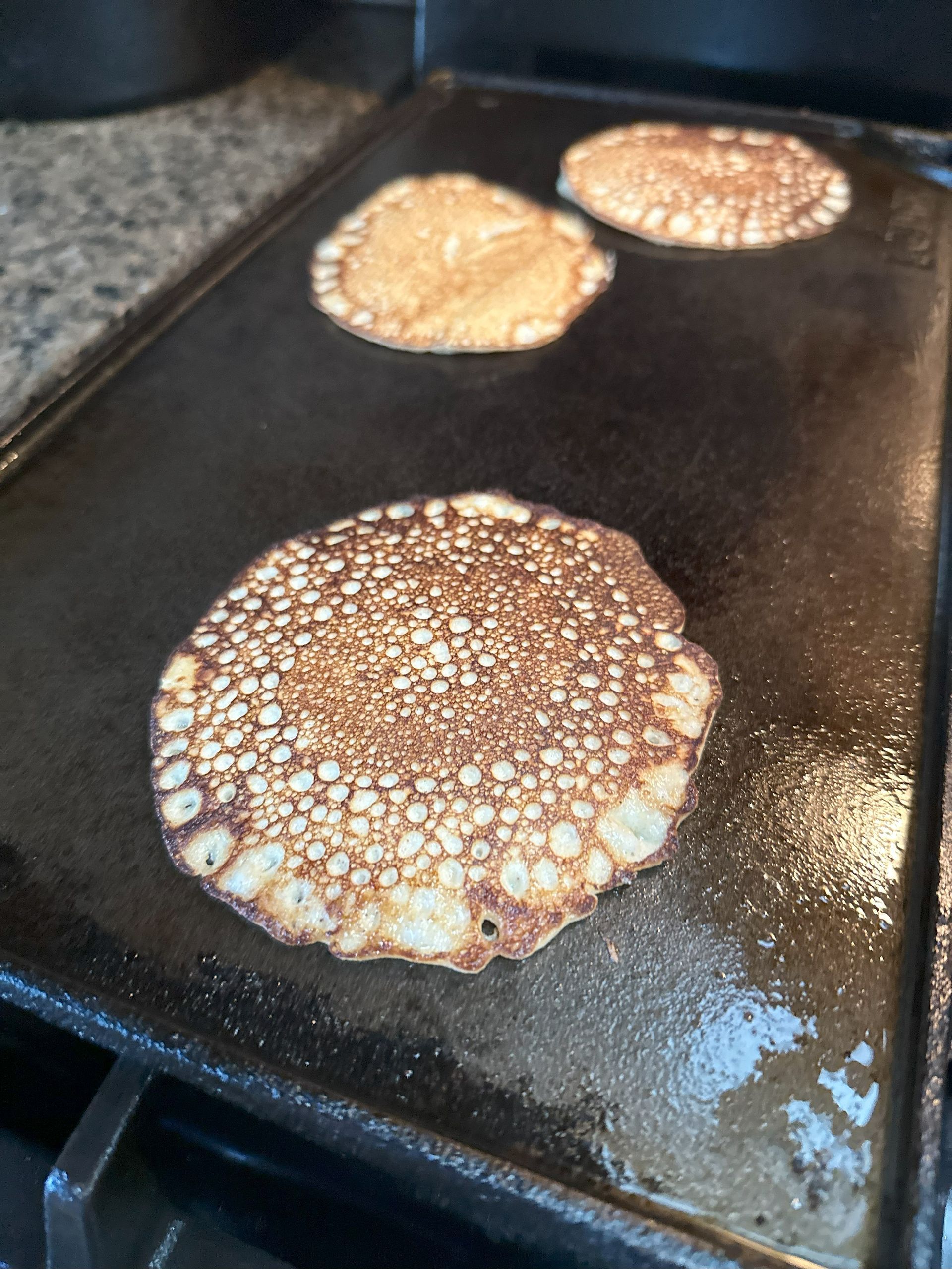 low carb pancakes on the lodge cast iron griddle on a gas stove