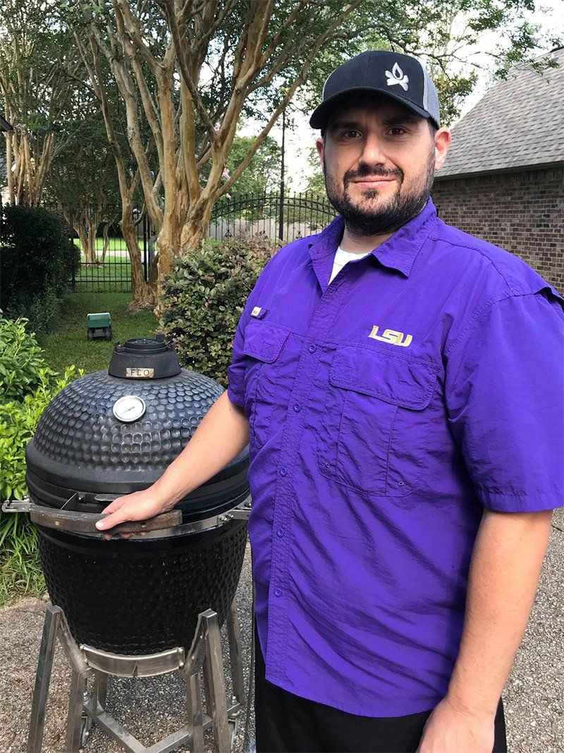 Content creator Josh Falcon  standing in front of a kamado grill