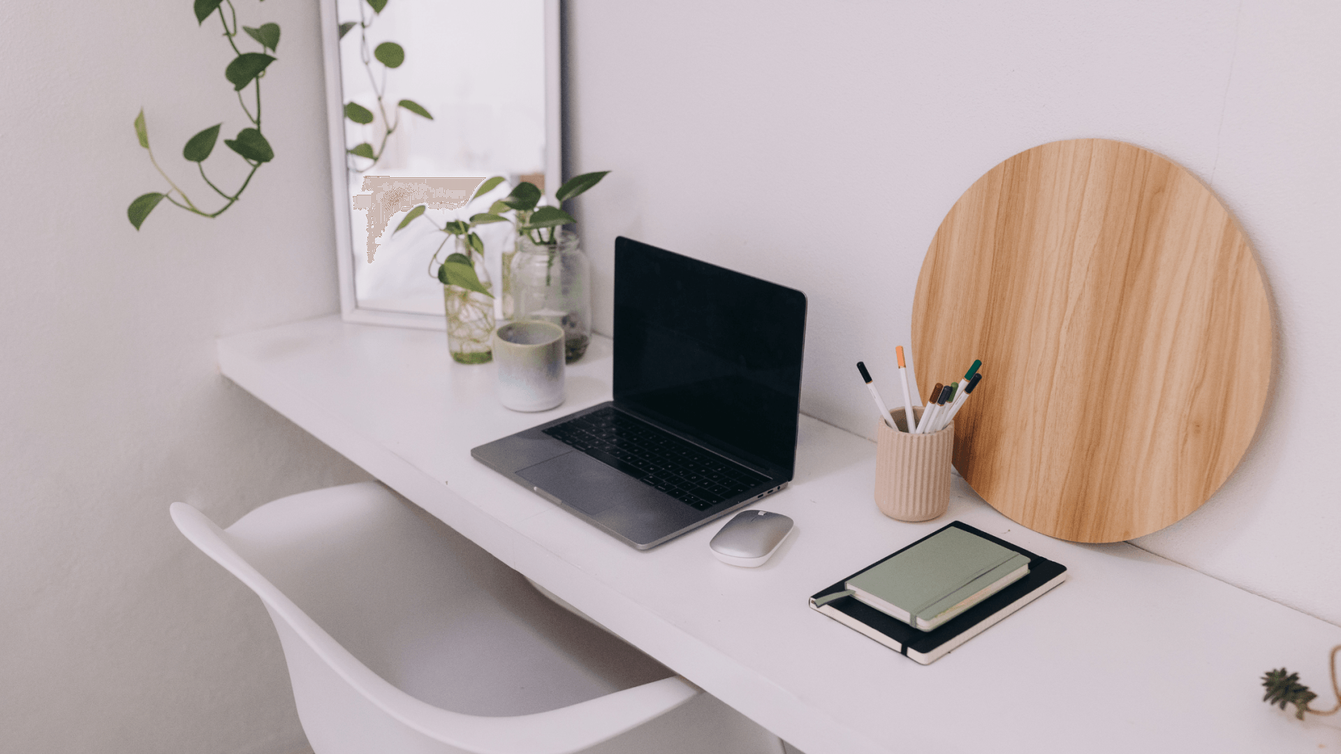 Scandinavian office desk with laptop and notebook