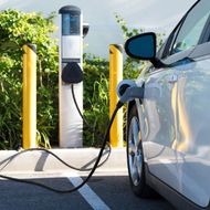 Electric Vehicle Next to a Charging Station