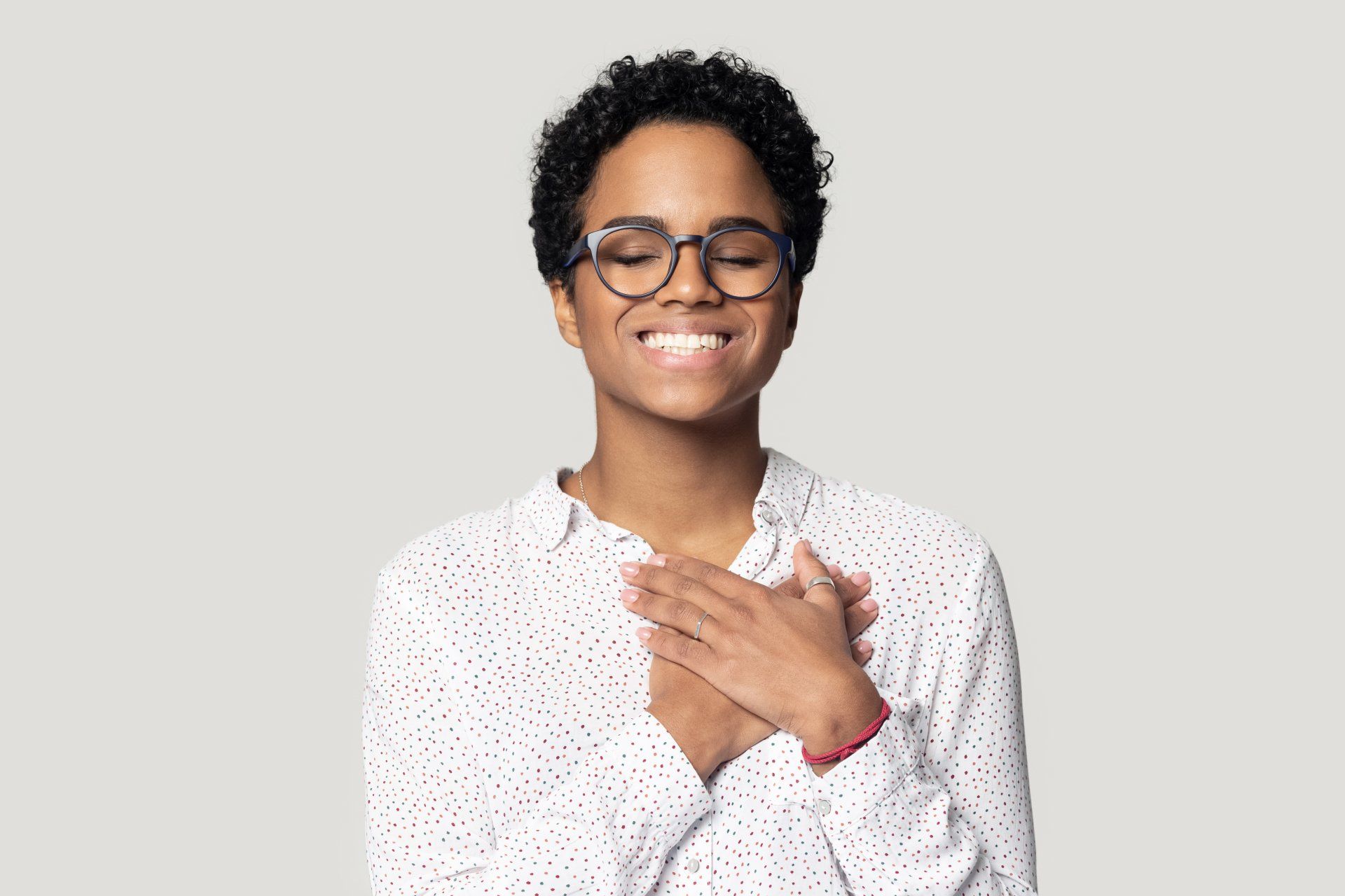 Grateful woman with her hands over her heart