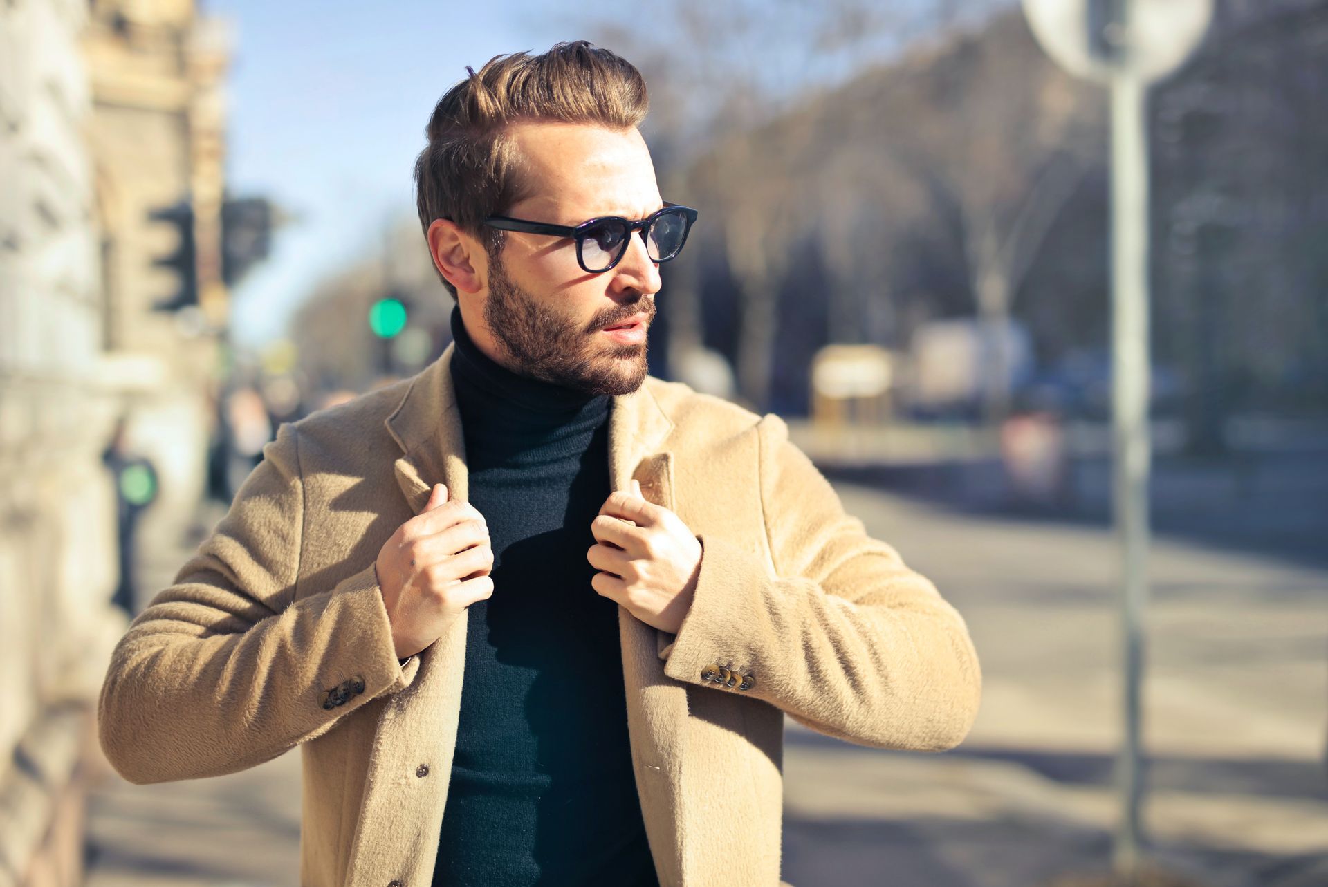 A man walks on a sidewalk looking into his career
