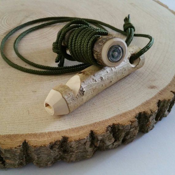 Wooden whistle with compass
