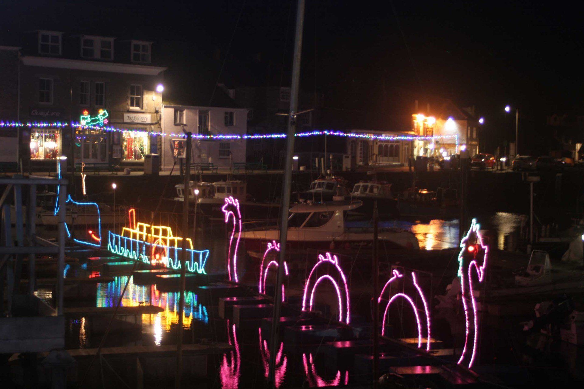 Padstow harbour  Christmas lights L A Kent DI Trelaor series Sad Pelican
