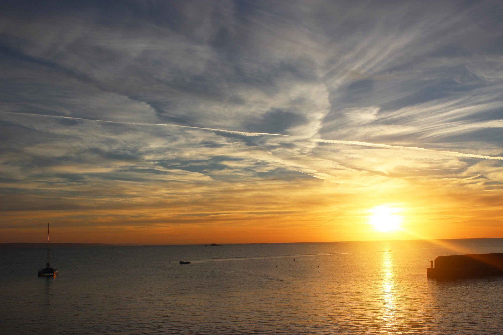 solitary fisherman at sunrise on Gorran Haven quay L A Kent Silent Gull DI Treloar series