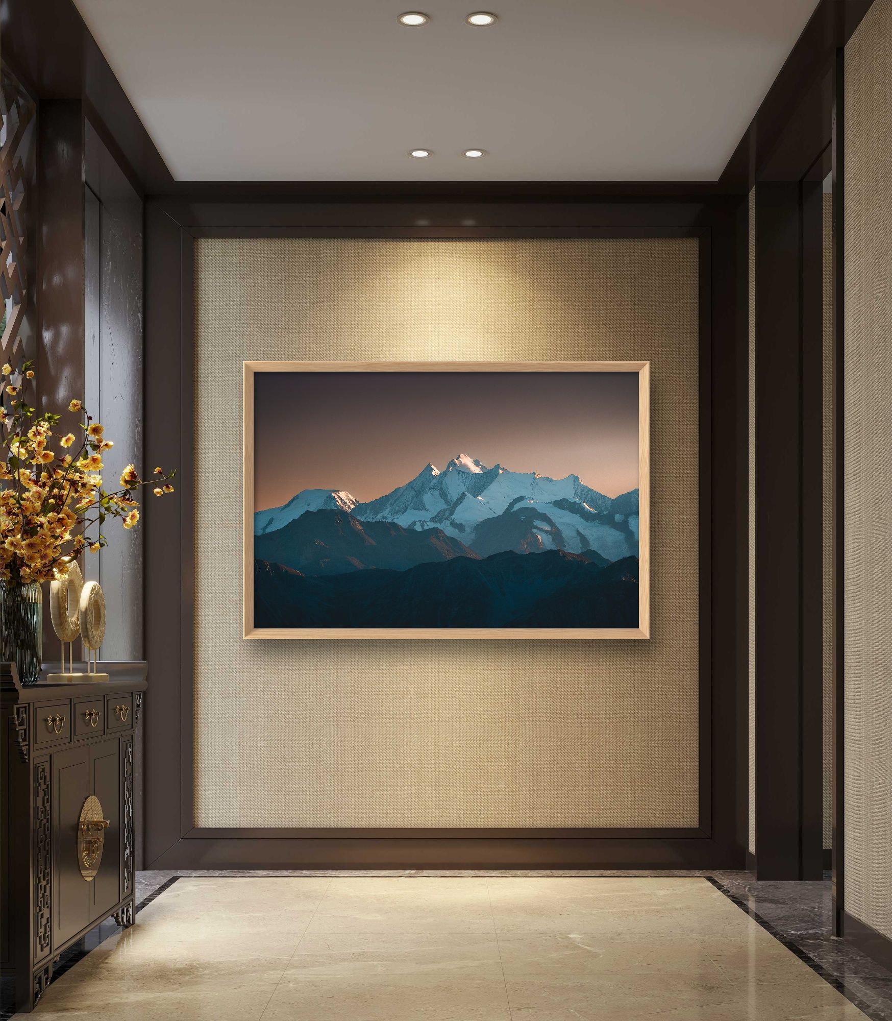 Landscape image of an impressive mountain backdrop as a mural in a hotel lobby.