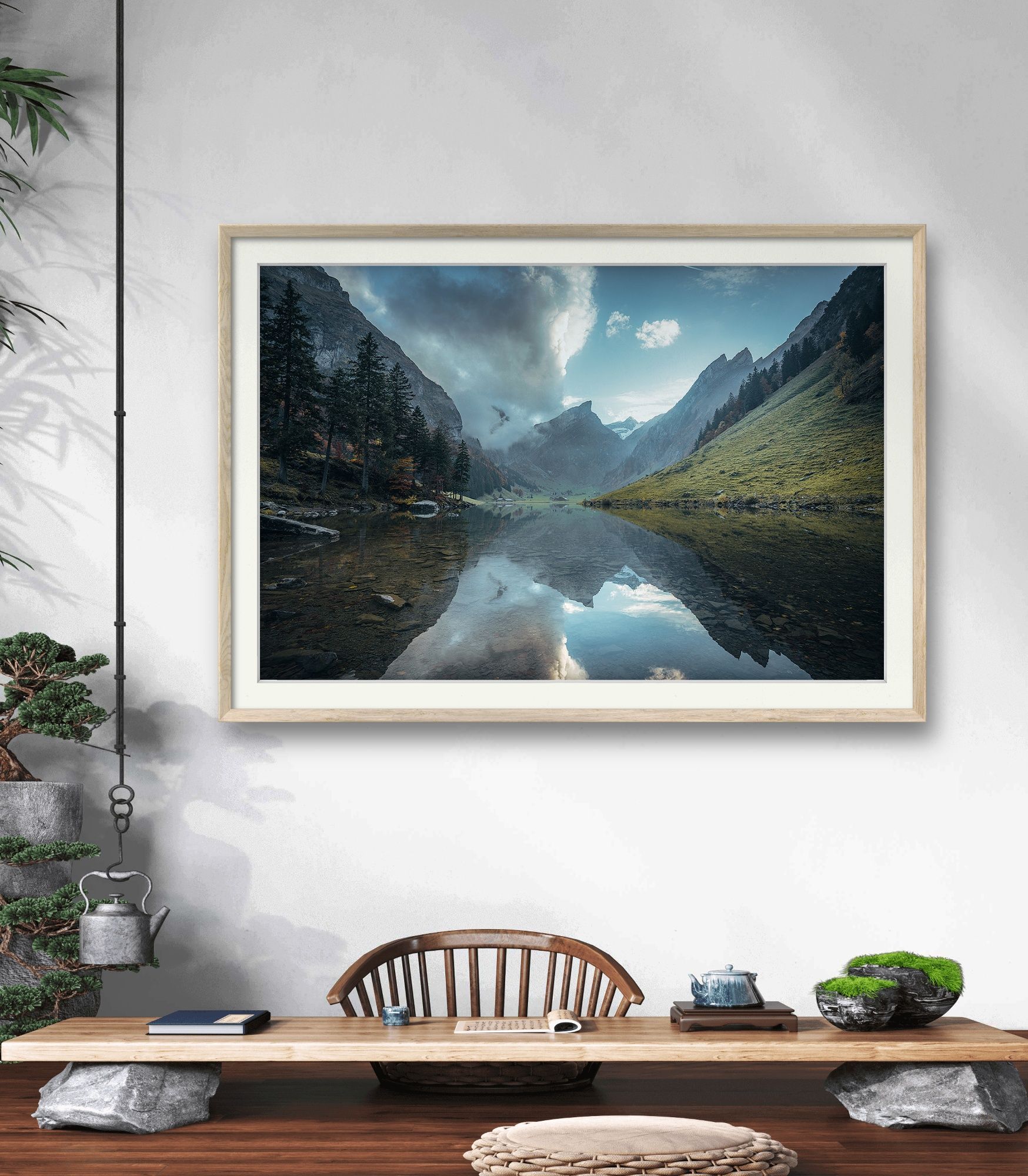 Landscape image of the Swiss Seealpsee with reflection of the mountain range in the lake as a mural in an office.